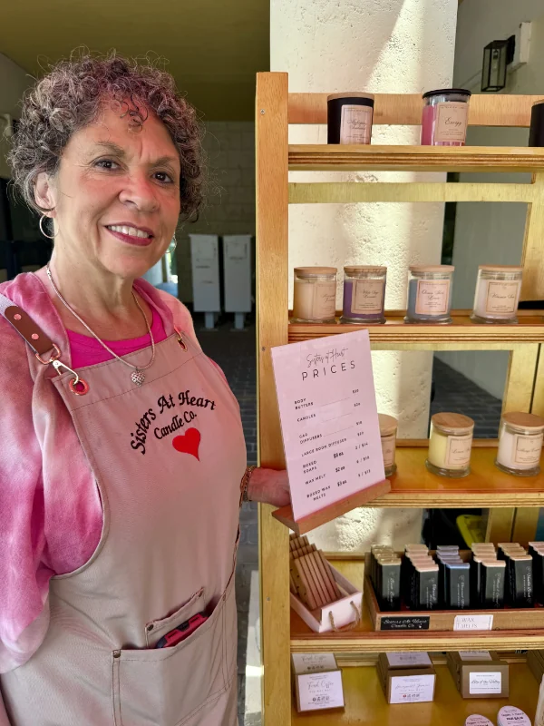 Sisters At Heart Candle Co booth display.